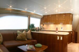 Buddy Davis 58 Sportfisherman helm station with dual Garmin displays, leather captain's chair, and center console steering...