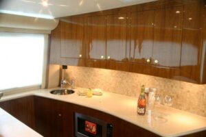 Buddy Davis 58 Sportfisherman helm station with dual Garmin displays, center console steering, and overhead hardtop with r...