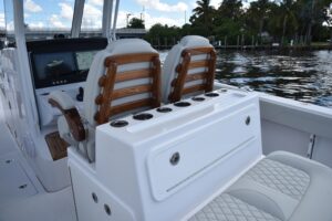 2026 Jupiter 380LS center console with bow seating and windshield viewed from starboard side.