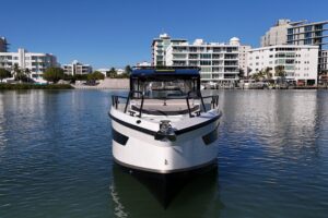 2026 Navan C30 center console helm station with dual Garmin displays and steering wheel in Fort Myers.