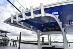 2027 Jupiter 34 center console cockpit seating area with forward leaning post and helm station visible aboard the 33.75-fo...