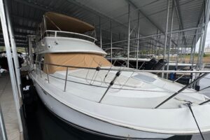 Carver 406 Aft Cabin Motor Yacht helm station with dual helm seats, steering wheel, and instrument panel.
