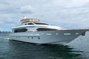 Bow view of 2000 Destiny 94-foot flybridge motor yacht showing forward deck seating and railing in Miami.