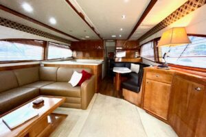 Stern view of 2001 Bertram 510 Convertible with transom, swim platform, and outrigger configuration in Key West.