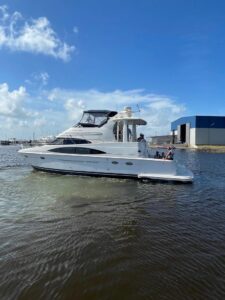 Stern view of 2001 Carver 444 Cockpit Motor Yacht showing transom, swim platform, and cockpit seating area.