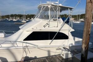 Stern view of 2001 Egg Harbor 42 Convertible with transom, swim platform, and outrigger bases in Huntington, NY.