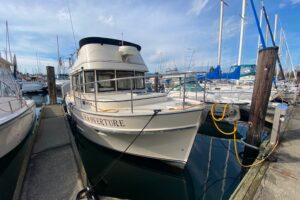 Bow view of 2002 Camano 30 cruiser showing forward seating and cabin entry in Anacortes, Washington.