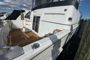 Carver 444 Cockpit Motor Yacht helm station with dual helm seats, steering wheel, and instrument panel.