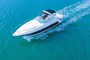 2003 Formula 34 Performance Cruiser starboard profile showing white hull, dual helm stations, hardtop, and running strakes...