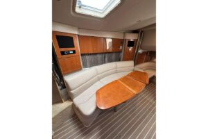 Helm station of 2003 Formula 34 Performance Cruiser with center console steering, dual Garmin chartplotter displays, throt...