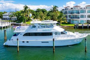 2003 Hatteras 75 Cockpit Motor Yacht with extended hardtop and radar arch viewed from the bow angle in Hillsboro Beach, Fl...