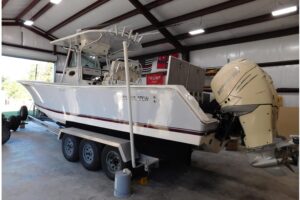 Bow view of 2003 Regulator 32 center console with forward seating and windshield.