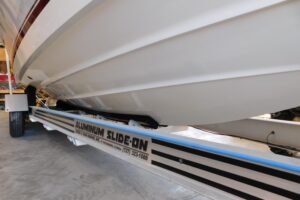 Regulator 32 center console helm station with dual Garmin displays, stainless steel wheel, and forward visibility over the...