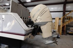 Regulator 32 center console helm station with dual Garmin displays, steering wheel, and throttle controls.