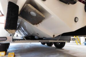 Transom view of 2003 Regulator 32 center console with swim platform and outboard engines.