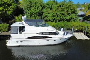 Bow view of 2004 Carver 466 Motor Yacht with forward seating and windshield in Stuart, Florida.