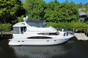 Stern view of 2004 Carver 466 Motor Yacht showing transom, swim platform, and dual exhaust ports.