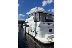 Carver 466 Motor Yacht galley with stainless steel appliances and wood cabinetry.