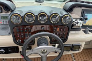 Carver 466 Motor Yacht salon with upholstered seating, entertainment center, and cabin access.