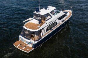Bow view of 2005 Carver 56 Voyager with forward seating and cabin windows in Fort Lauderdale.