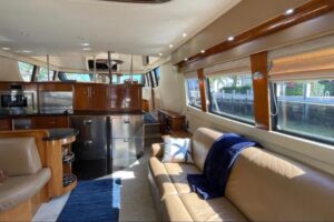 Galley with stainless steel appliances, white cabinetry, and granite countertops aboard 2005 Carver 56 Voyager motor yacht.
