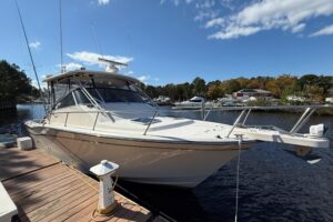 Grady-White Express 330 bow with forward seating and windshield viewed from starboard side.