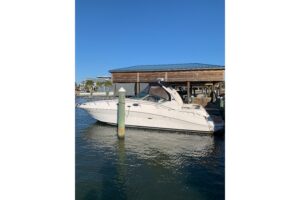 2005 Sea Ray 340 Sundancer 37.5-foot cruiser with white hull and hardtop profile viewed from starboard side in Pass Christ...