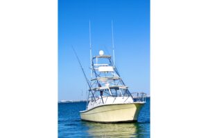 Topaz Express Cruiser 32-foot cabin cruiser helm station with dual helm seats, steering wheel, and forward visibility thro...