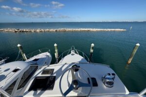 Galley with stainless steel appliances and cabinetry aboard 2006 Topaz 32 Express Cruiser.