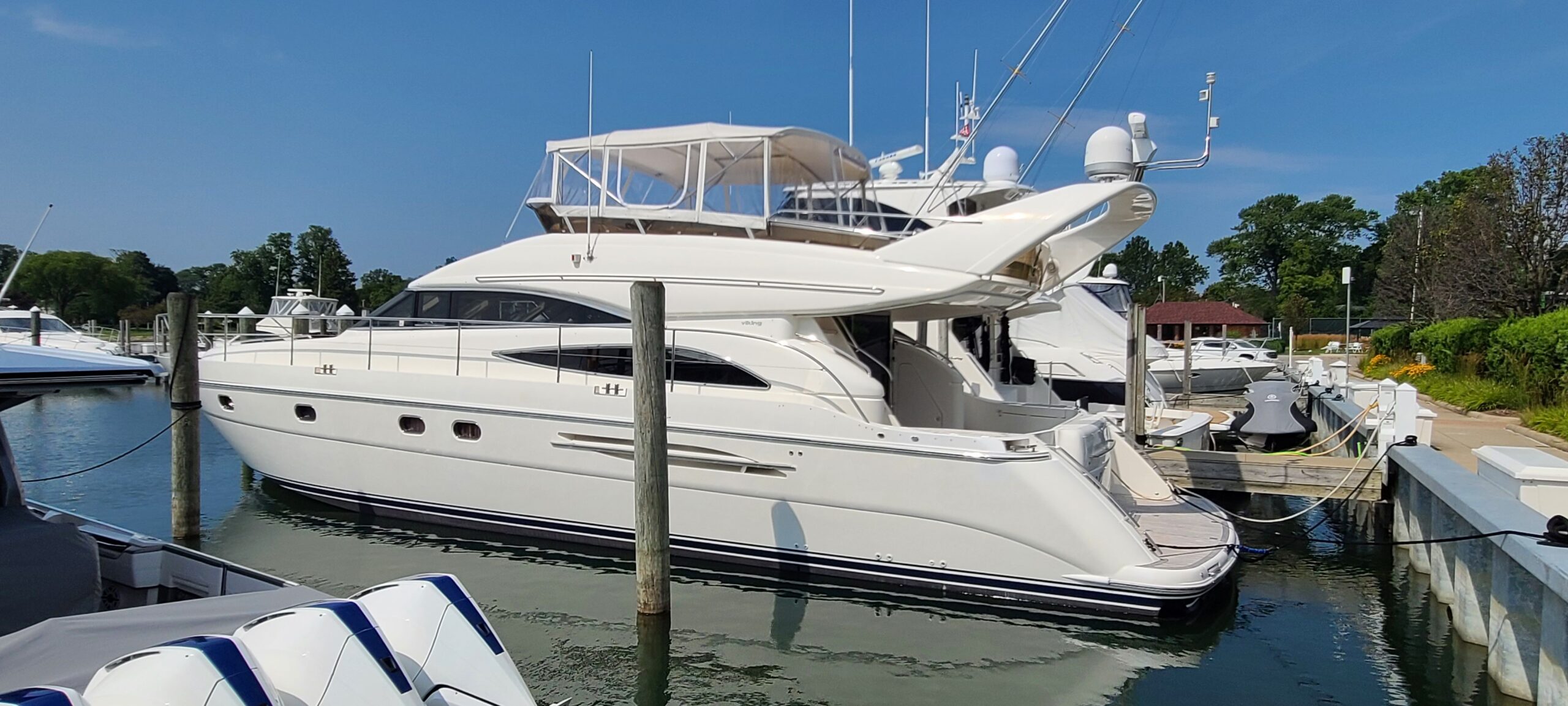 2006 Viking Princess 61 Flybridge motor yacht starboard profile showing full-length exterior with dual flybridge and hardt...