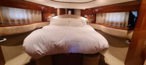 Viking Princess 61 Flybridge flybridge helm station with dual helm chairs, Garmin electronics, and forward visibility over...