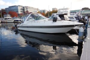 2007 Cruisers 340 Express 34-foot cruiser with white hull and hardtop viewed from starboard side in Seattle waters.