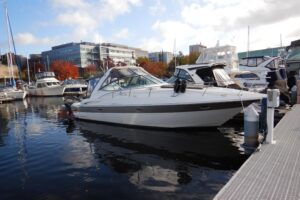 Galley with stainless steel appliances and white cabinetry in 2007 Cruisers 340 Express.