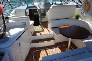 Galley with stainless steel appliances and wood cabinetry in 2007 Cruisers 340 Express.