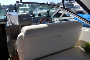 Helm station of 2007 Cruisers 340 Express with dual helm seats, center console steering, and forward windshield view.
