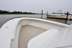 Gamefisherman 42 Walkaround center console helm with Garmin sonar displays and dual throttle controls.