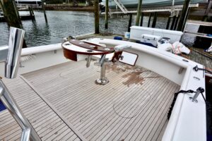 Gamefisherman 42 Walkaround sonar-equipped center console helm with Garmin electronics and steering wheel.