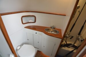 Gamefisherman 42 Walkaround center console helm with sonar-equipped electronics and steering controls.