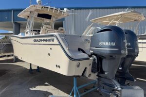 2007 Grady-White Bimini 306 center console fishing yacht with hardtop and outboard engines moored in Pompano Beach, Florida.