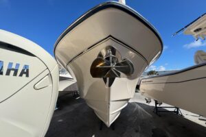 2007 Grady-White Bimini 306 center console helm station with dual Garmin displays and steering wheel under hardtop.