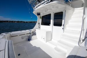 2007 Luhrs 36 Convertible cabin interior with forward berth and natural lighting through porthole windows.