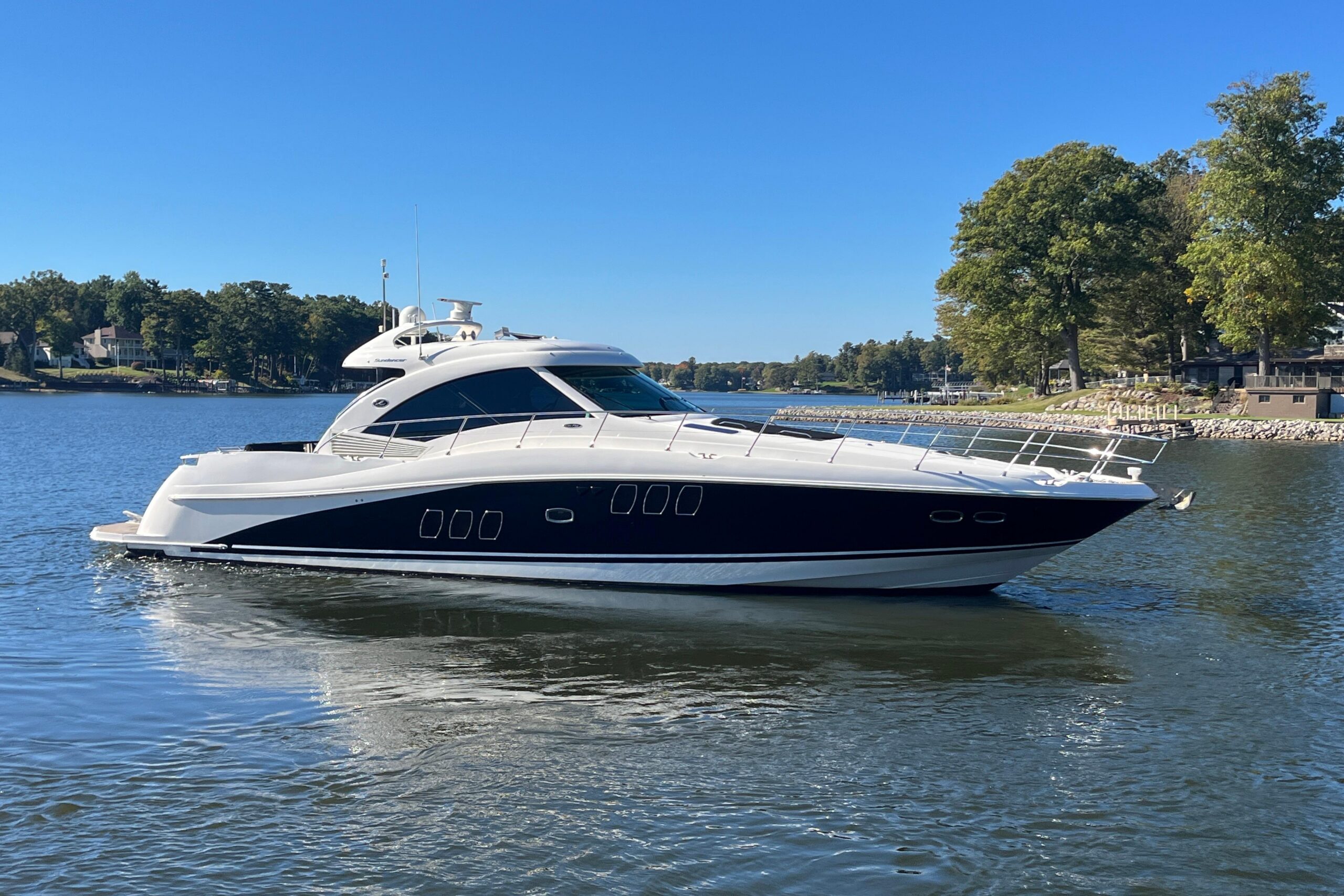 2007 Sea Ray 60 Sundancer yacht profile starboard side exterior view moored in Spring Lake Michigan