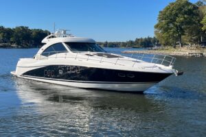 Bow view of 2007 Sea Ray 60 Sundancer with teak rail and forward seating area.