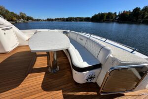 2007 Sea Ray 60 Sundancer salon with neutral upholstery, overhead lighting, and entertainment system.