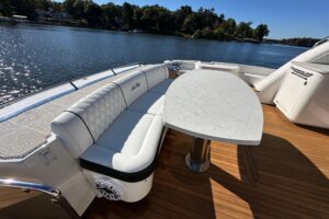 2007 Sea Ray 60 Sundancer salon with upholstered seating, entertainment center, and cabin lighting.