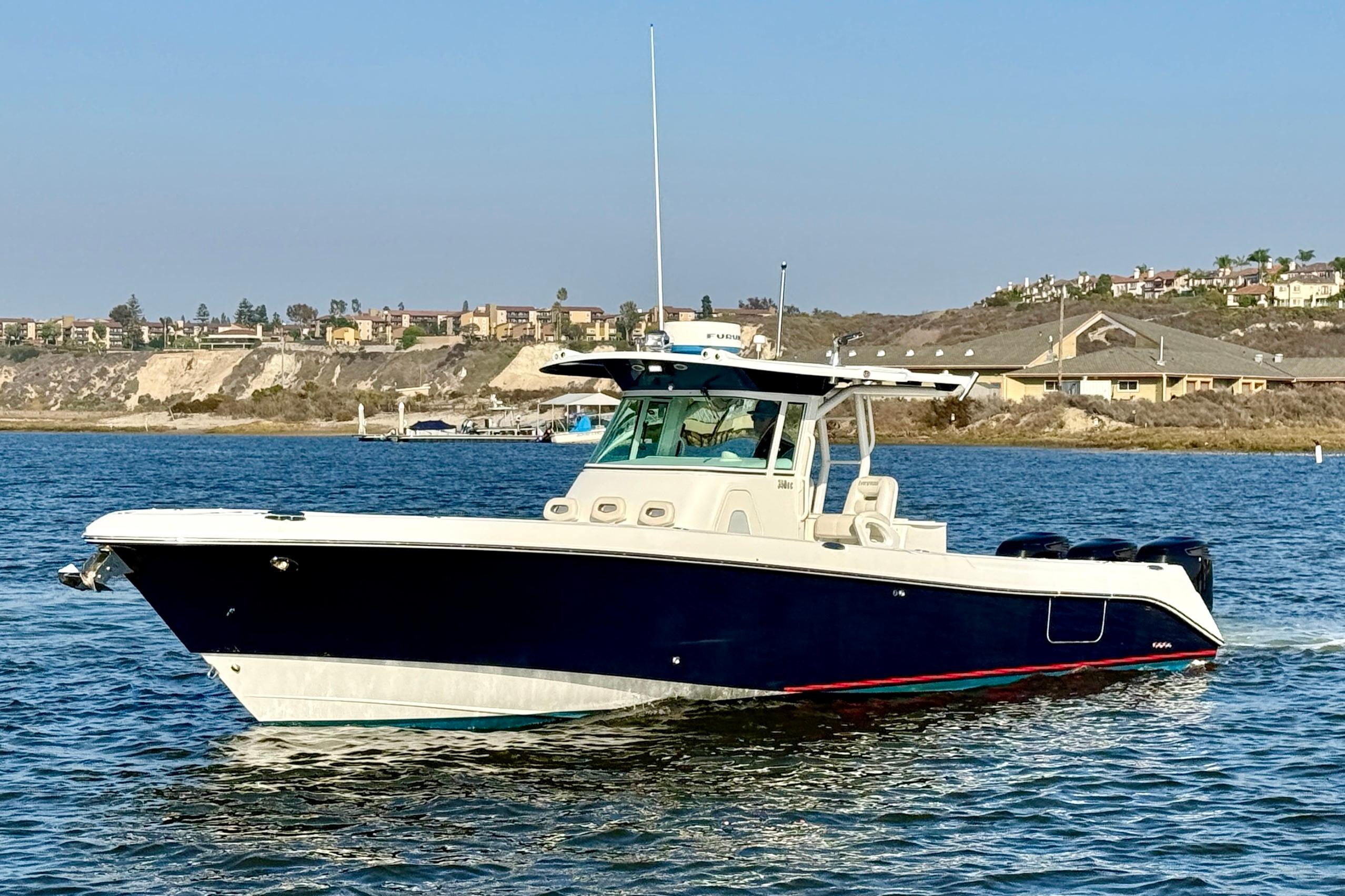 2008 Everglades 350 center console with twin outboard engines and hardtop viewed from starboard side in Newport Beach.