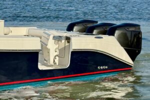 Helm station of 2008 Everglades 350 center console with dual Garmin displays, steering wheel, and throttle controls.