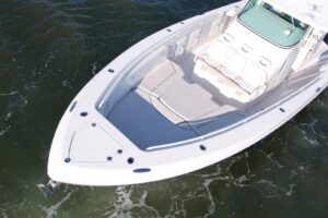 Helm station of 2008 Everglades 350 center console with dual Garmin displays, steering wheel, and throttle controls.