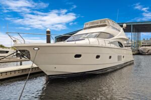 2008 Marquis 65 motor yacht exterior profile starboard side view in Fort Lauderdale showing full-length hull design with h...