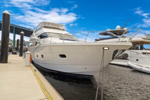 Bow view of 2008 Marquis 65 motor yacht showing forward seating and cabin profile in Fort Lauderdale.